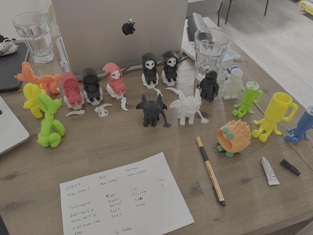 Collection of colorful BajkBuddy figurines arranged on a table